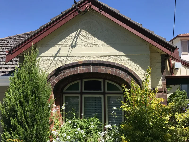 The Annandale brick arch after wall crack repair, crack closed, render patched and the prop gone