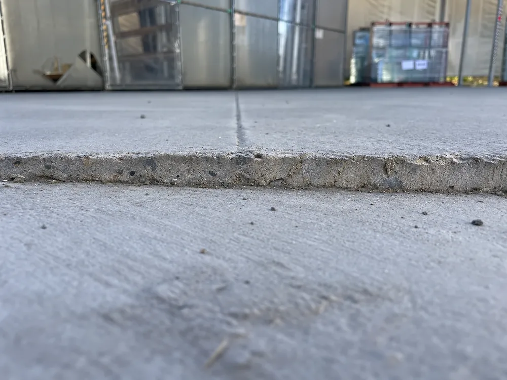 Before: the yard slab stepped at the joint in Rylock’s Dingley Village warehouse, seen at ground level