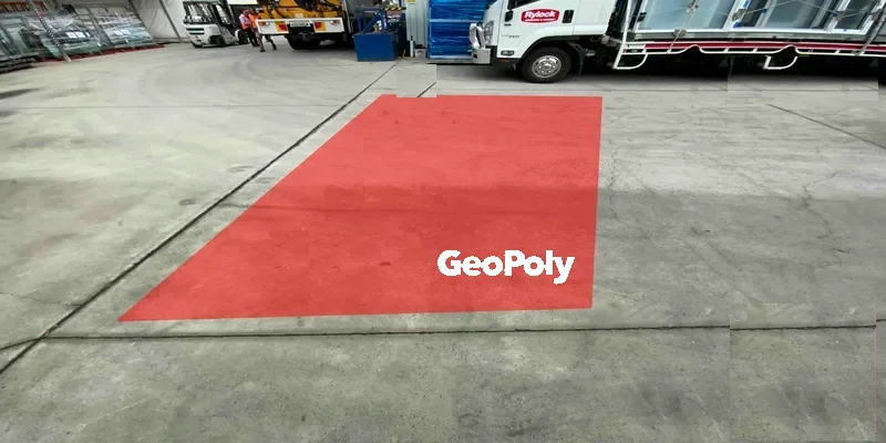 Engineer’s repair detail marking the GeoPoly™ treatment area in red on the Dingley Village yard slab, with a truck and the roller doors behind