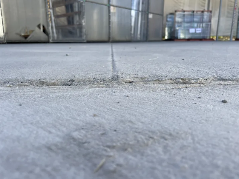 After: the same joint at ground level, the Dingley Village yard slab back to level