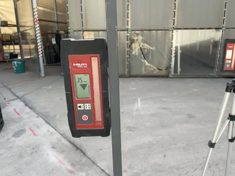 Hilti PRA 30 laser receiver reading 35mm of lift on the Rylock warehouse slab at Dingley Village
