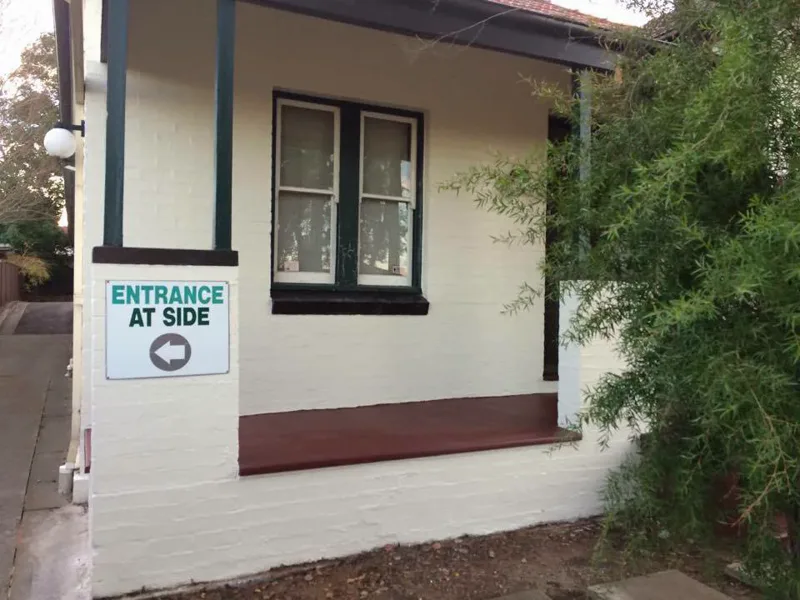 Repaired and repainted front verandah of the Summer Hill doctor's surgery, cracks gone and the Entrance At Side sign back on the pier