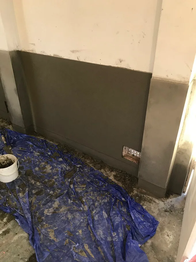 Salt-retardant render neatly applied to interior wall after DampBlock treatment at Frenchs Forest home