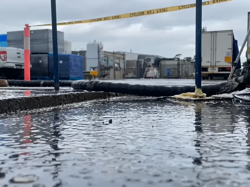 Before: the sunken loading slab at Cordina Farms, Girraween, holding water at a step along its edge, injection pipes in place