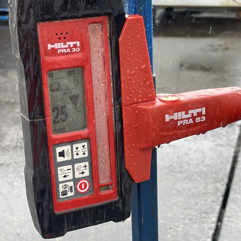 Hilti PRA 30 laser receiver reading 25mm of lift on the Girraween loading slab during GeoPoly™ injection