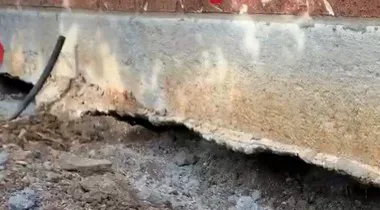 Void under the edge of the concrete slab of The Gap home where the fill had slipped away