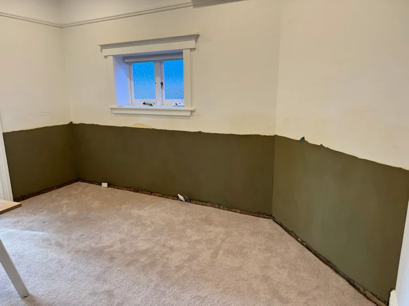 Interior room with salt-retardant render applied to walls after DampBlock treatment at Mosman home