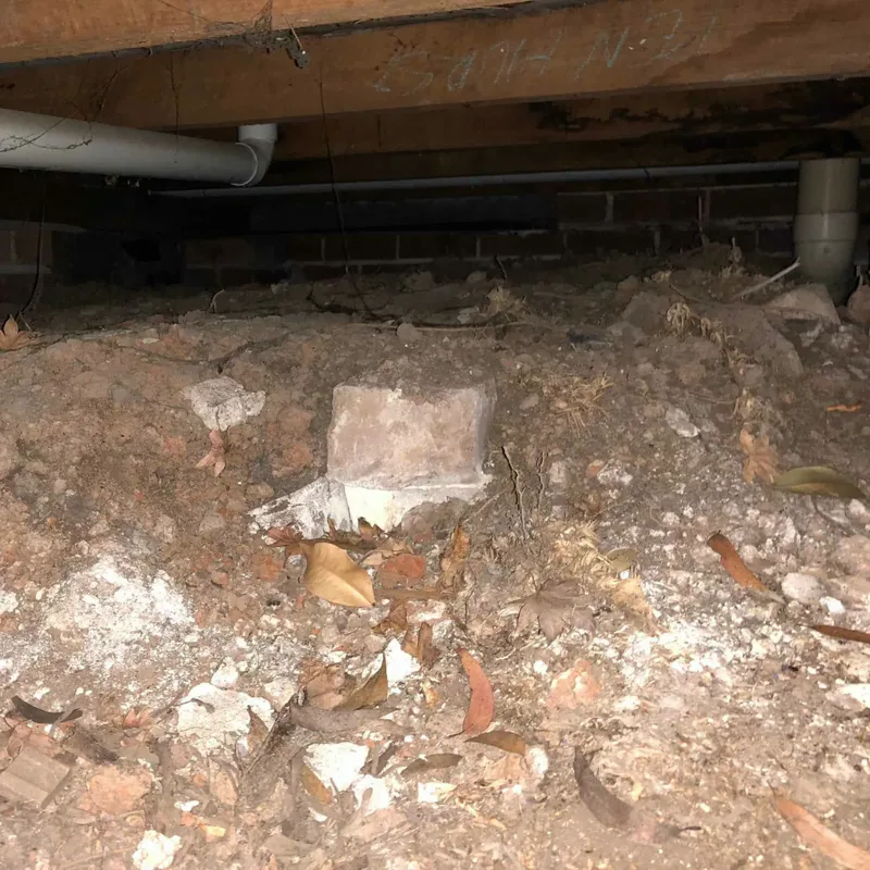 a disconnected drainpipe underneath the verandas outside the townhouse.
