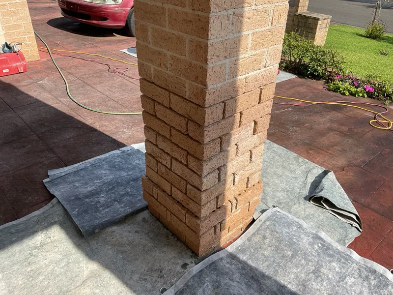 Close-up of brick balcony pillar at Prestons home showing deteriorated brickwork from rising damp