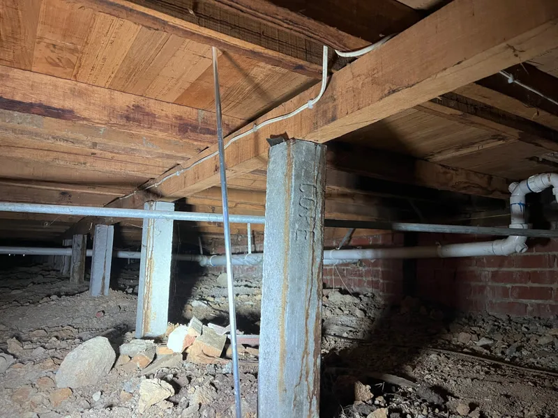 Close-up of concrete stump and bearer connection in subfloor