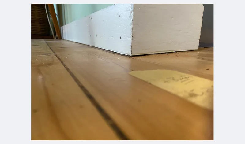 Floor level restored at wall corner after GeoPoly™ pier repair