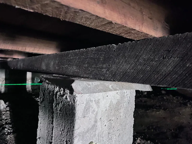 Stump and bearer connection tight with laser level confirming level