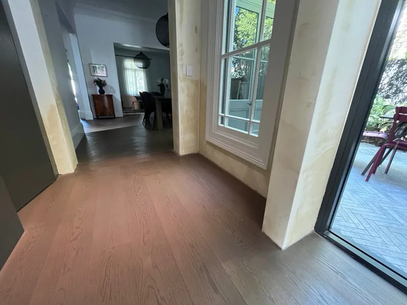 Stanmore terrace hallway with walls showing fresh render after DampBlock treatment