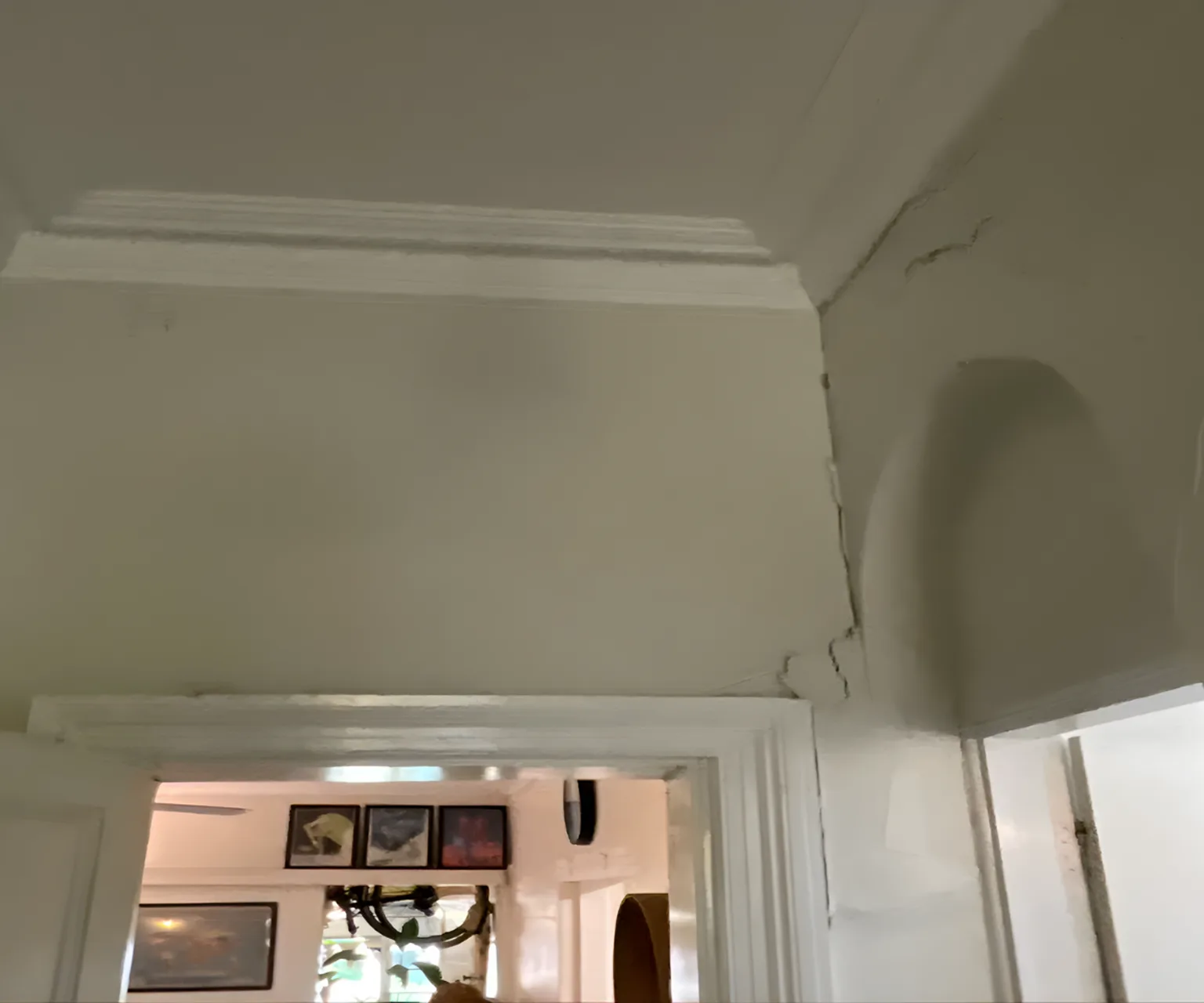 Cracked walls at the junction between old extension and original heritage structure