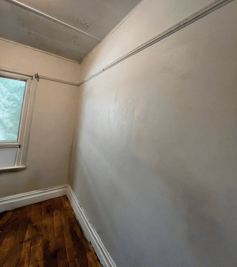 Same wall fully plastered and smooth after repair