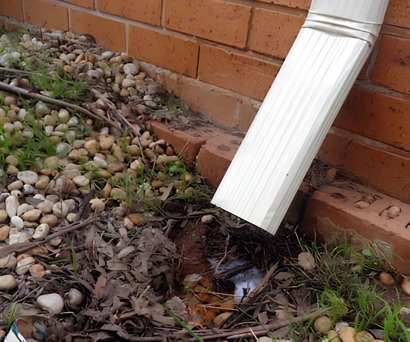 Disconnected downpipe saturating soil next to a Melbourne home foundation