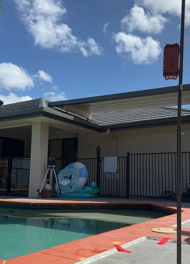 Uneven tile edges around pool surround from slab settlement