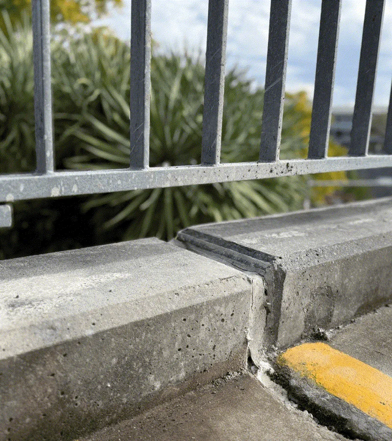 Same kerb relevelled and sitting flush against railing base