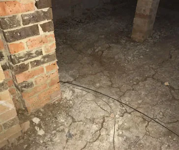 Reactive clay soil beneath floor piers expanding and contracting with moisture