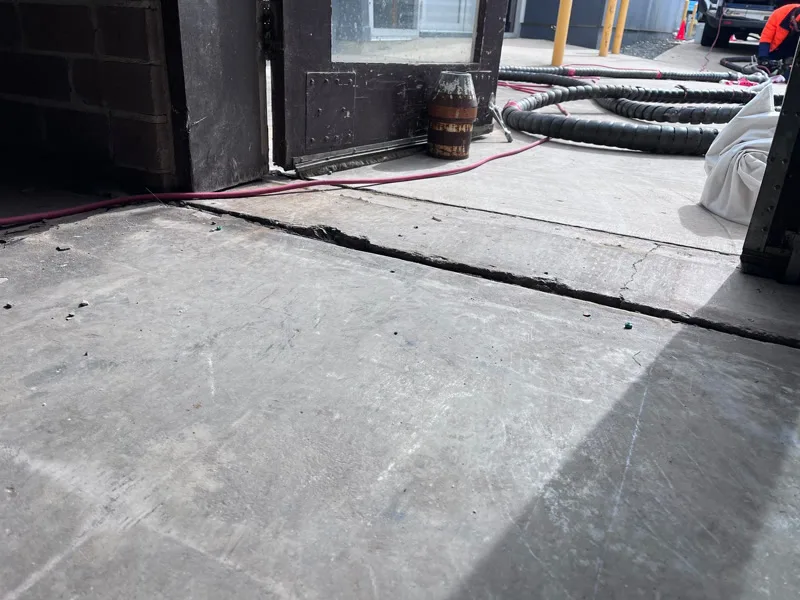 Same doorway floor after relevelling — gap reduced