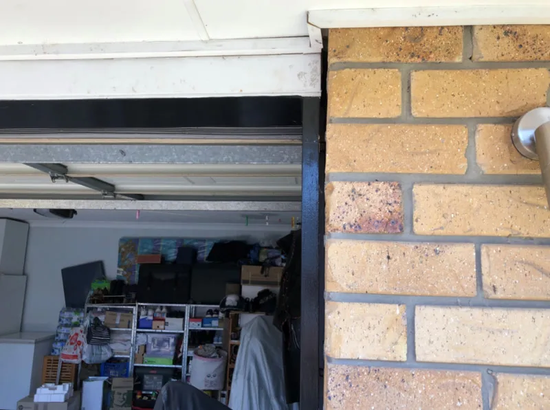 Same garage door opening with gap reduced — after