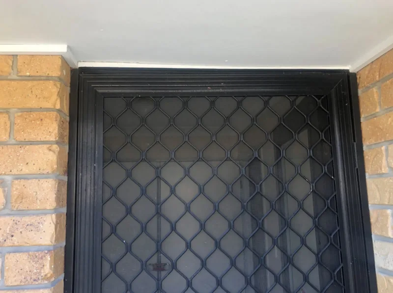 Same security screen door with gap closed — after