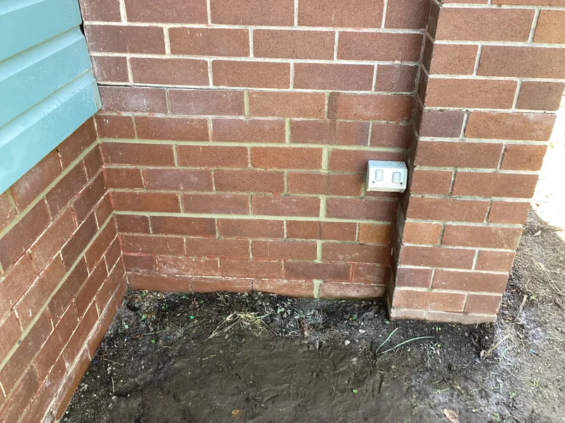 Same brick corner with crack closed after repair