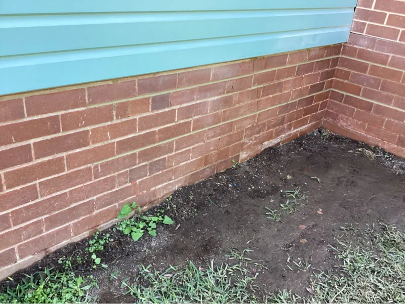 Same brick wall base with crack repaired