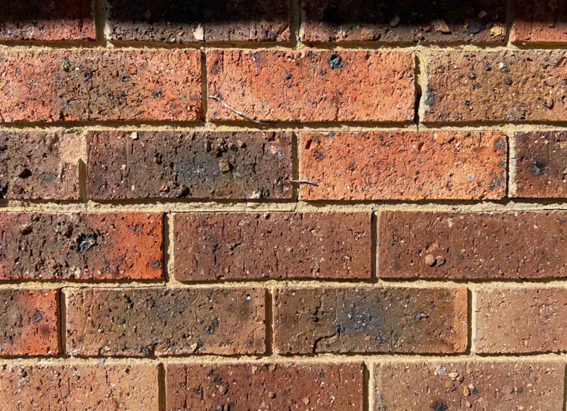 Repaired brick wall with no visible crack remaining