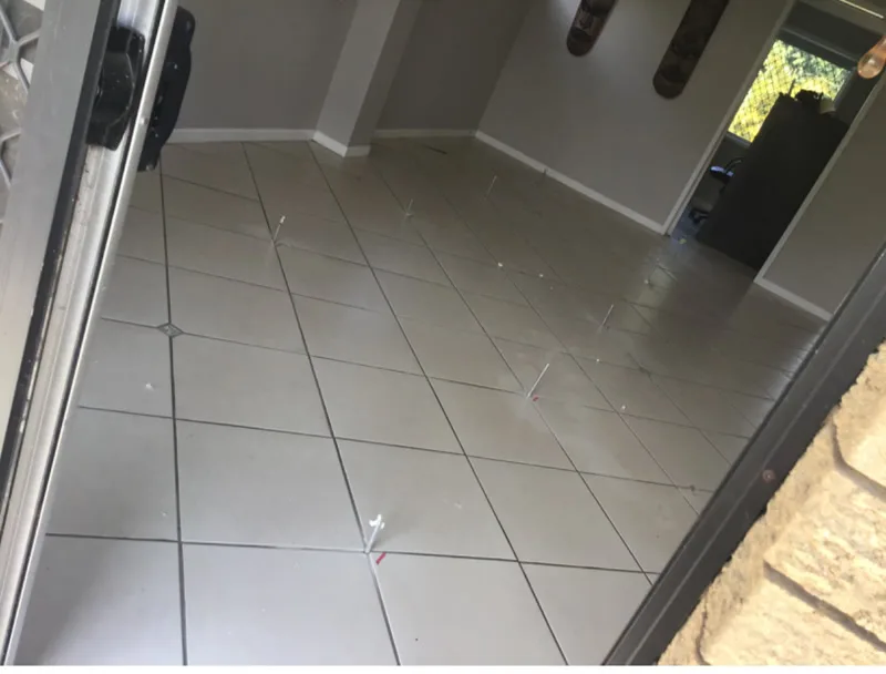 Tiled floor with injection ports marked across room