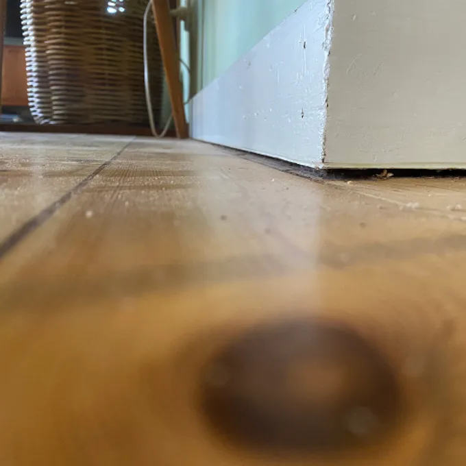 Sunken floor showing visible slope from subsidence