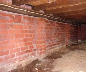 Water erosion undermining house foundations