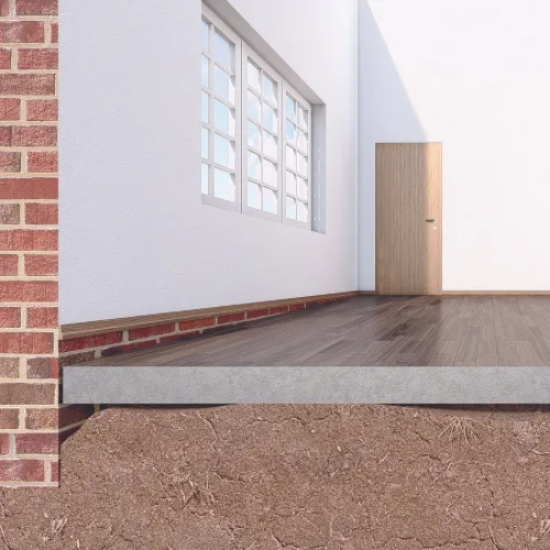 Sunken concrete slab alongside a home showing visible settlement
