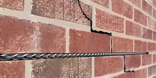 HelicalBar stainless steel reinforcement being installed in cracked brick wall