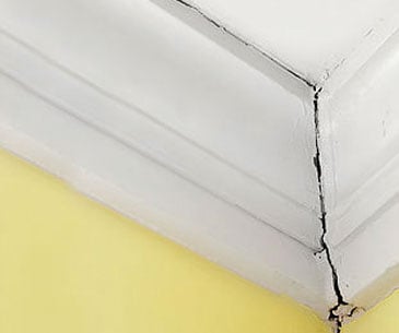 cracked-corner Wall crack in the corner of a room