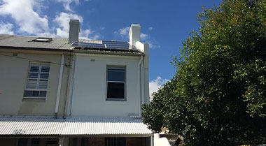 White two-storey house with stable foundation after subsidence repair using GeoPoly injection.