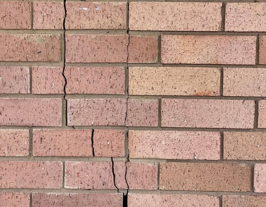 Vertical wall crack in brickwork indicating foundation subsidence and GeoPoly repair need.