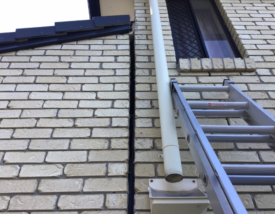 Large vertical wall crack near window signals subsidence, needs foundation repair solutions.