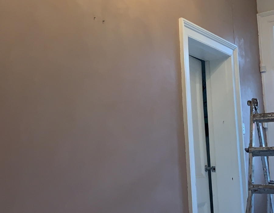 Newly plastered wall after subsidence and wall cracks foundation repair completion.