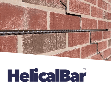 Brick wall with large cracks reinforced by HelicalBar foundation repair system.