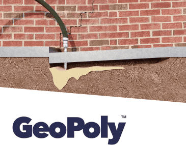 Brick wall foundation cracks repaired with GeoPoly injection and warranty badge displayed.