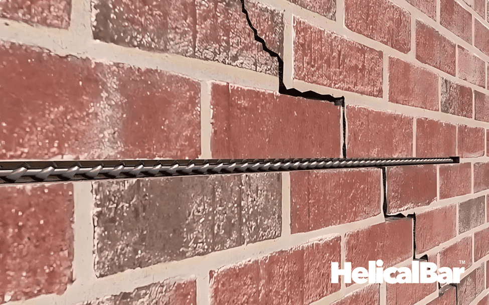 HelicalBar reinforcing diagonal wall crack in red brick for foundation repair.
