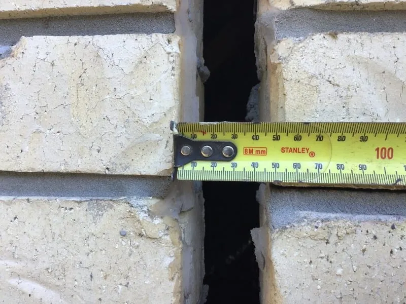 Structural stepped crack in exterior brick wall