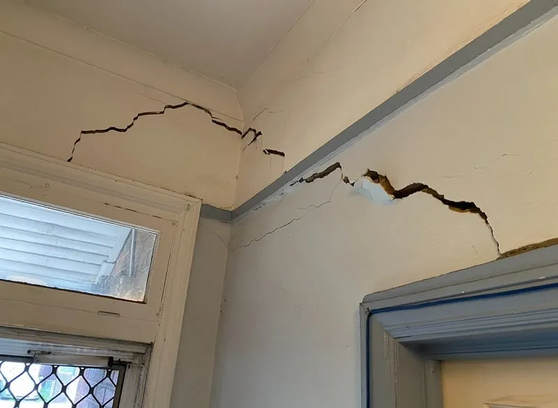 Foundation crack from poor drainage.